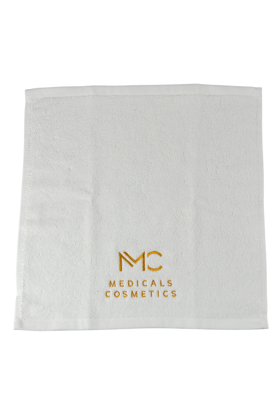 TOWEL MEDICALS COSMETICS SMALL WHITE, GOLDEN LOGO 
Kis pamut törölköző Medicals Cosmetics fehér arany hímzéssel